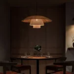 Warm ambient lighting from Kyoto rattan pendant in dining room.