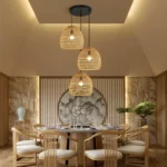 Cluster of woven dome rattan lights hanging over a long table.