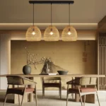 Three artisan woven dome rattan pendants hanging in a row.