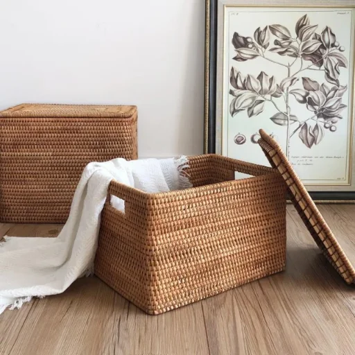 Neat rattan organiser box placed on a shelf for tidy storage.