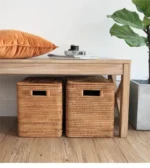 Natural cane storage box styled on a table surface.