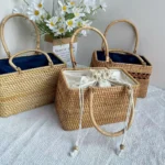 Handwoven rattan Sunday market tote bag isolated front view.