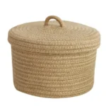 Natural woven round storage basket isolated view.